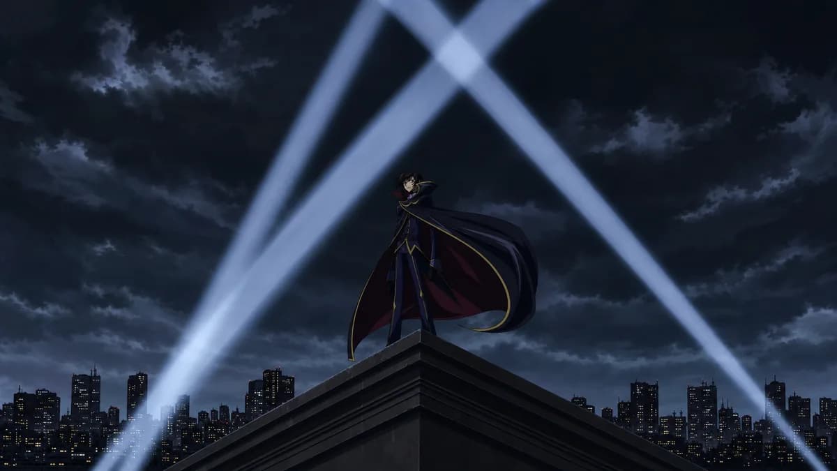 Lelouch small against a night city as searchlight beams cross overhead.