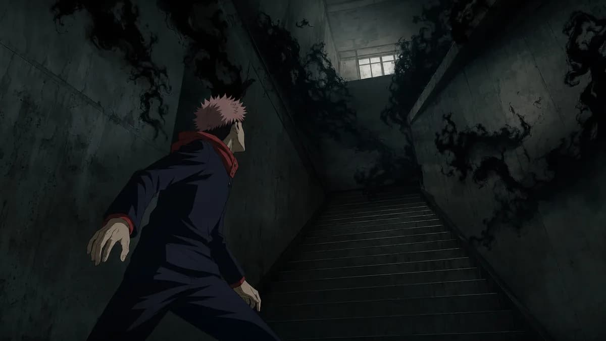Yuji facing a knot of black curse-smoke gathering in a dim concrete stairwell.