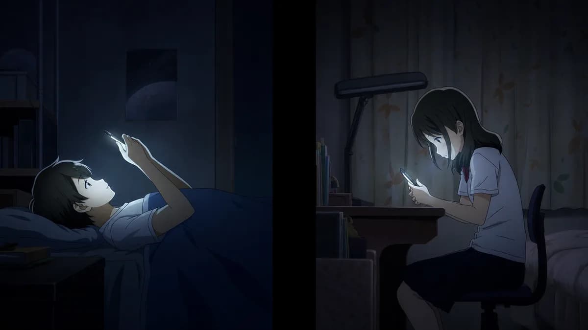 Two teenagers on opposite sides of the frame at night, each lit by a phone screen.