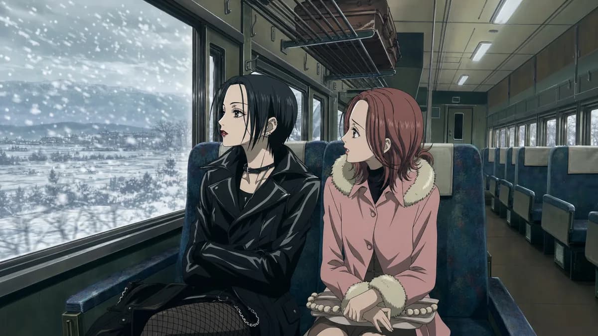 Two young women sitting side by side on a snowbound long-distance train, strangers.